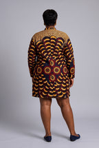 Full back view of Saffron Halo gold and burgundy African print shirt dress with long sleeves