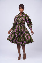 Full-length shot of a woman styling a geometric print Ankara shirt dress