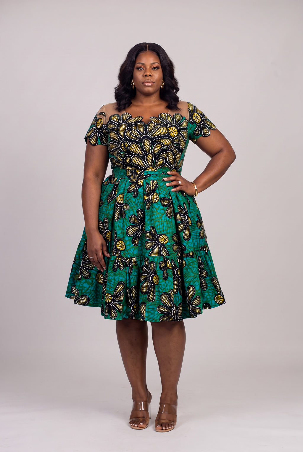 Plus size model wearing Teal Flora Ankara wedding guest dress