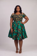 Plus size model wearing Teal Flora Ankara wedding guest dress