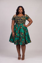Plus size model wearing Teal Flora Ankara wedding guest dress