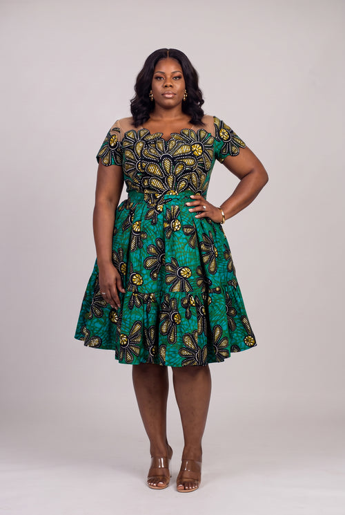 Plus size model wearing Teal Flora Ankara wedding guest dress