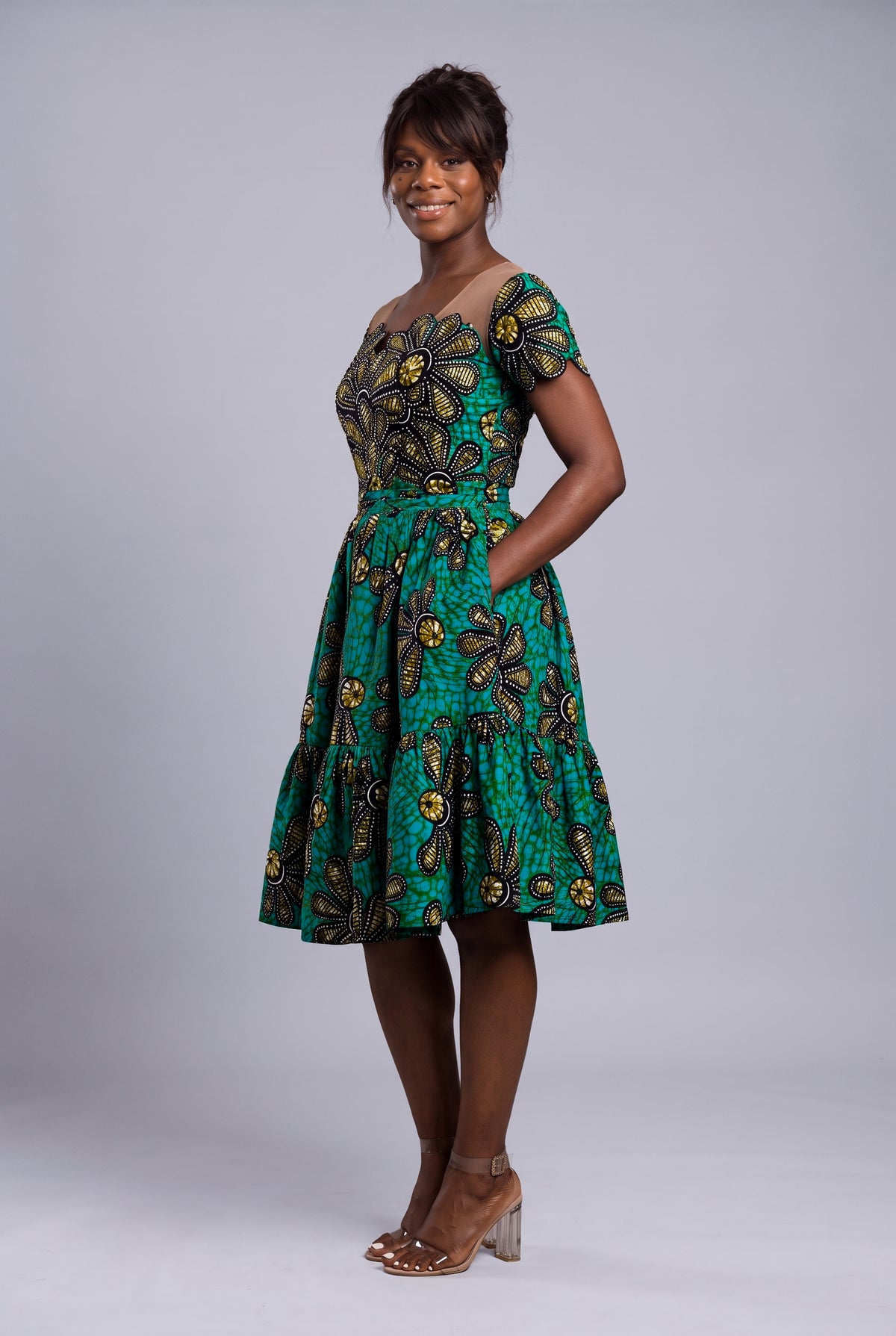 Side profile of Teal Flora rhinestone African print midi dress
