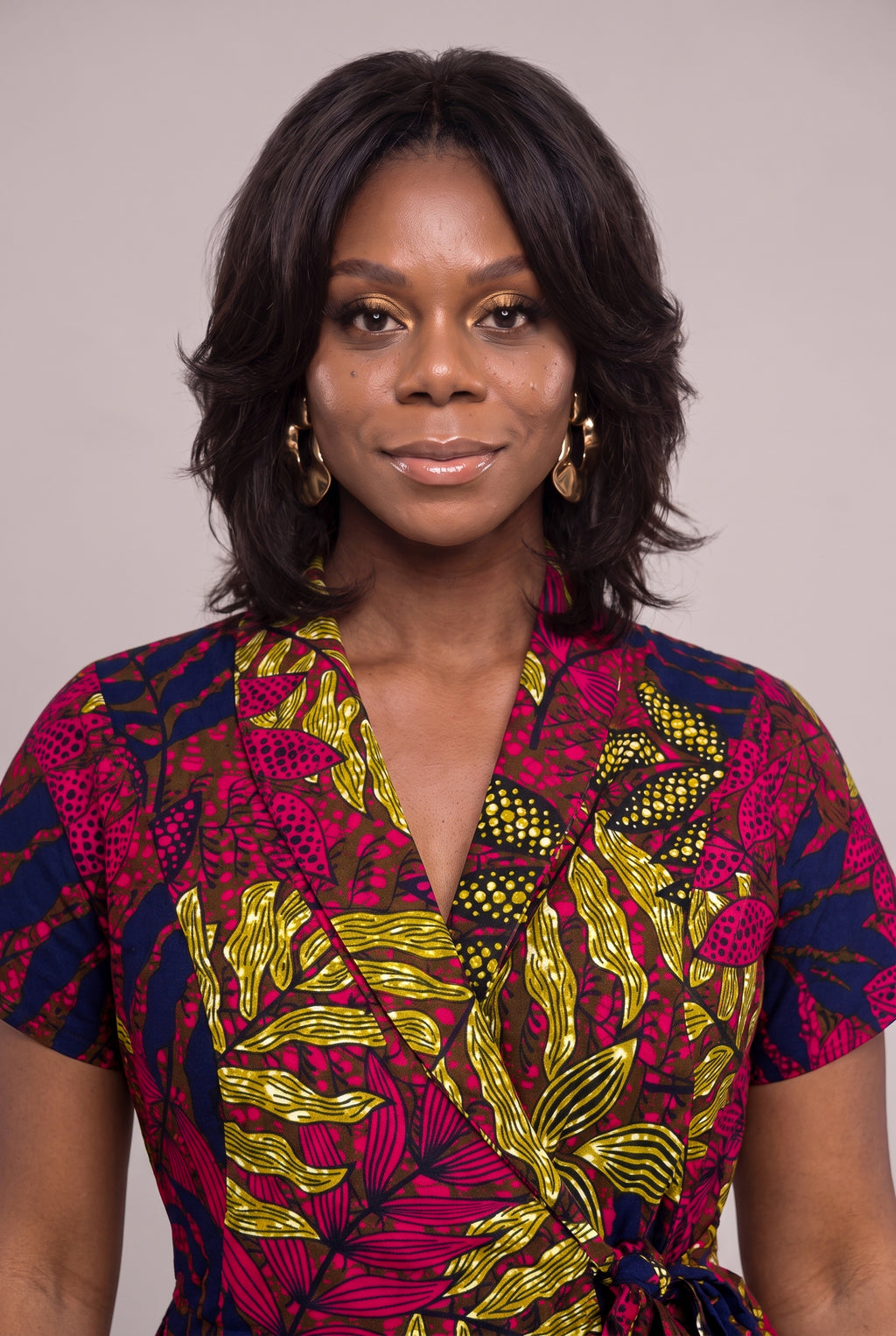 Close-up portrait of African wrap dress with shawl collar