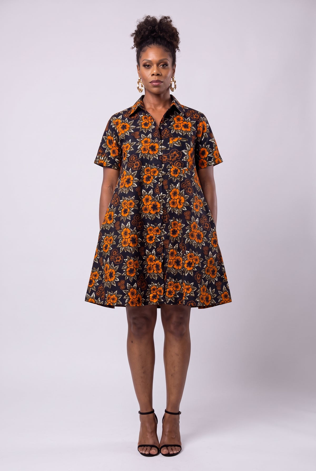 Full length view of Amber Bloom orange African print swing shirt dress with deep pockets