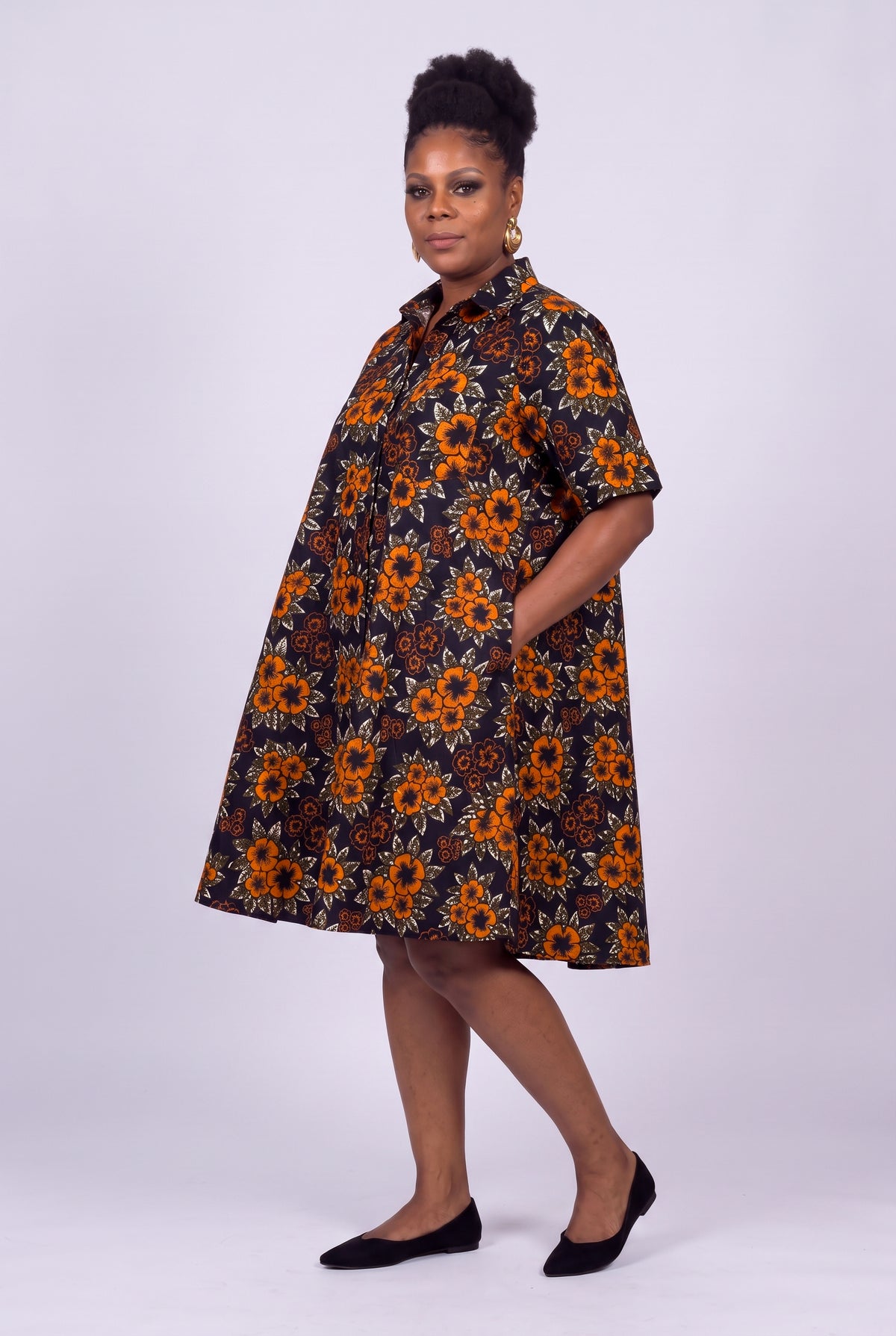 Three quarter view of Amber Bloom African print swing dress