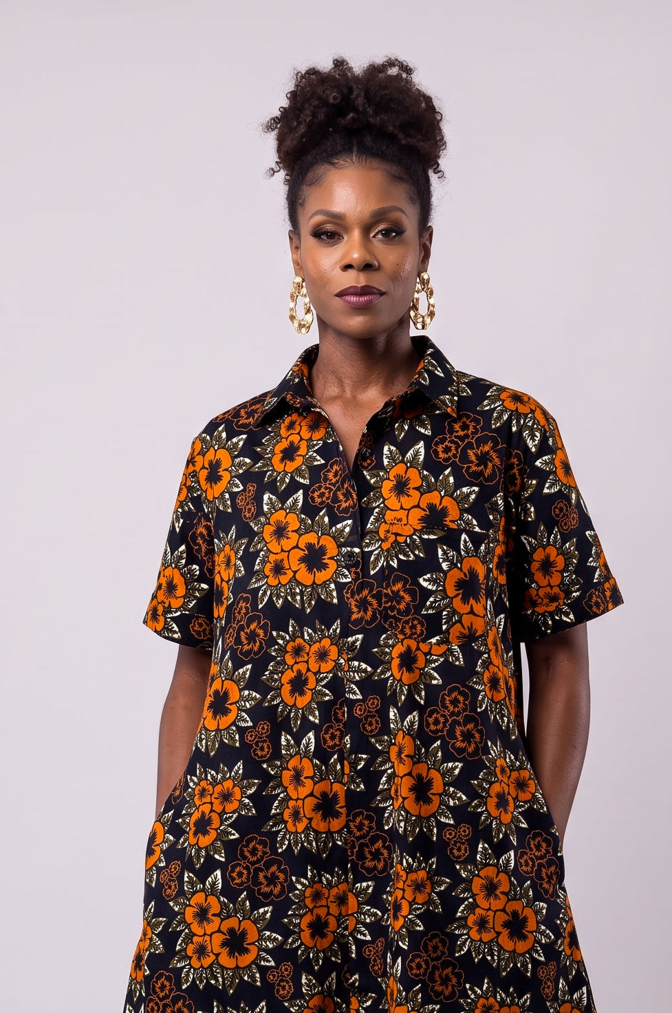 Close up of Amber Bloom African print shirt dress with classic collar and button front