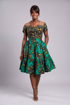 Model walking in Teal Flora African print wedding guest dress