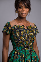 Detail view of teal gold and black Ankara wax print fabric