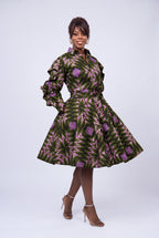 Model walking in Olive Ray Ankara shirt dress with side pockets