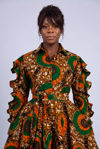Close-up portrait of a model highlighting the classic point collar and button-through detail of an African wax print dress