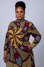  Close side view of Burgundy Helix African print shirt dress in burgundy gold grey and black