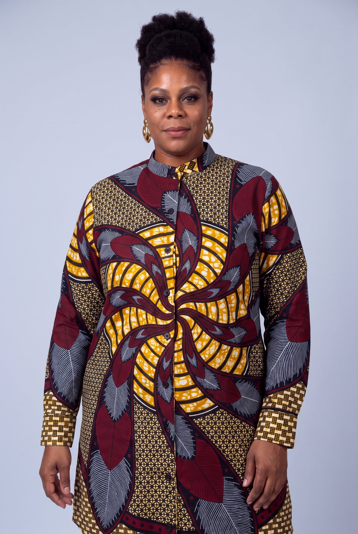 Plus size model wearing Burgundy Helix African print long sleeve shirt dress