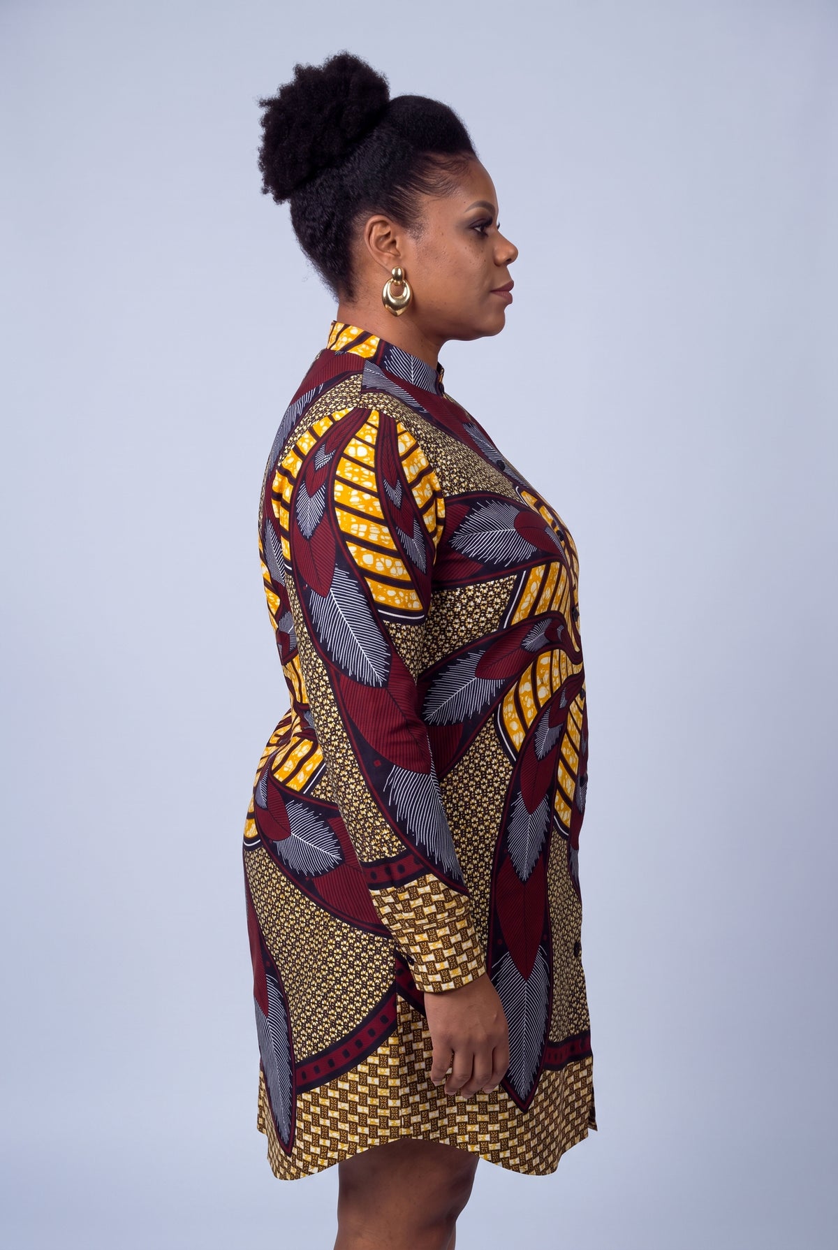  Side view of plus size model wearing Burgundy Helix burgundy Ankara shirt dress