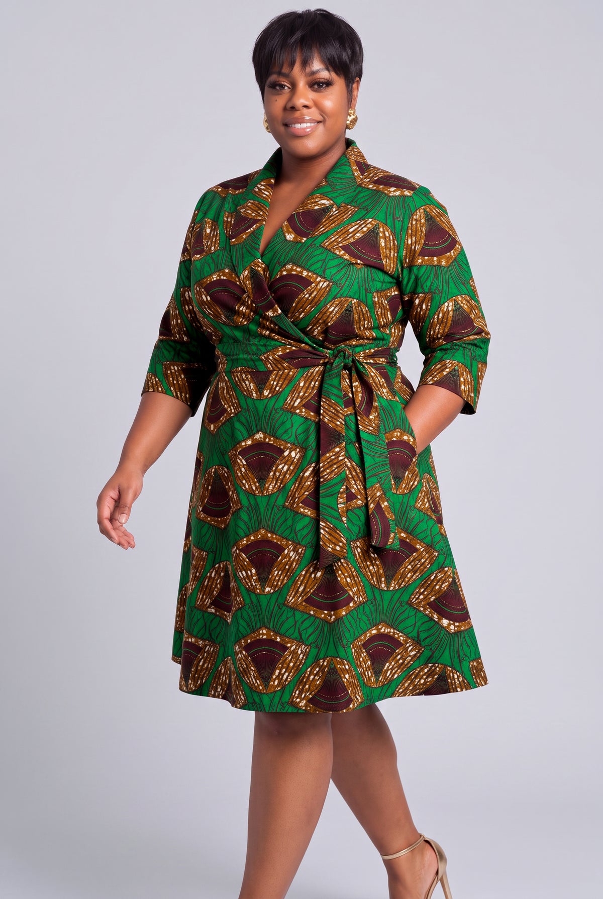 Side profile of Forest Oasis African print wrap midi dress with three quarter sleeves