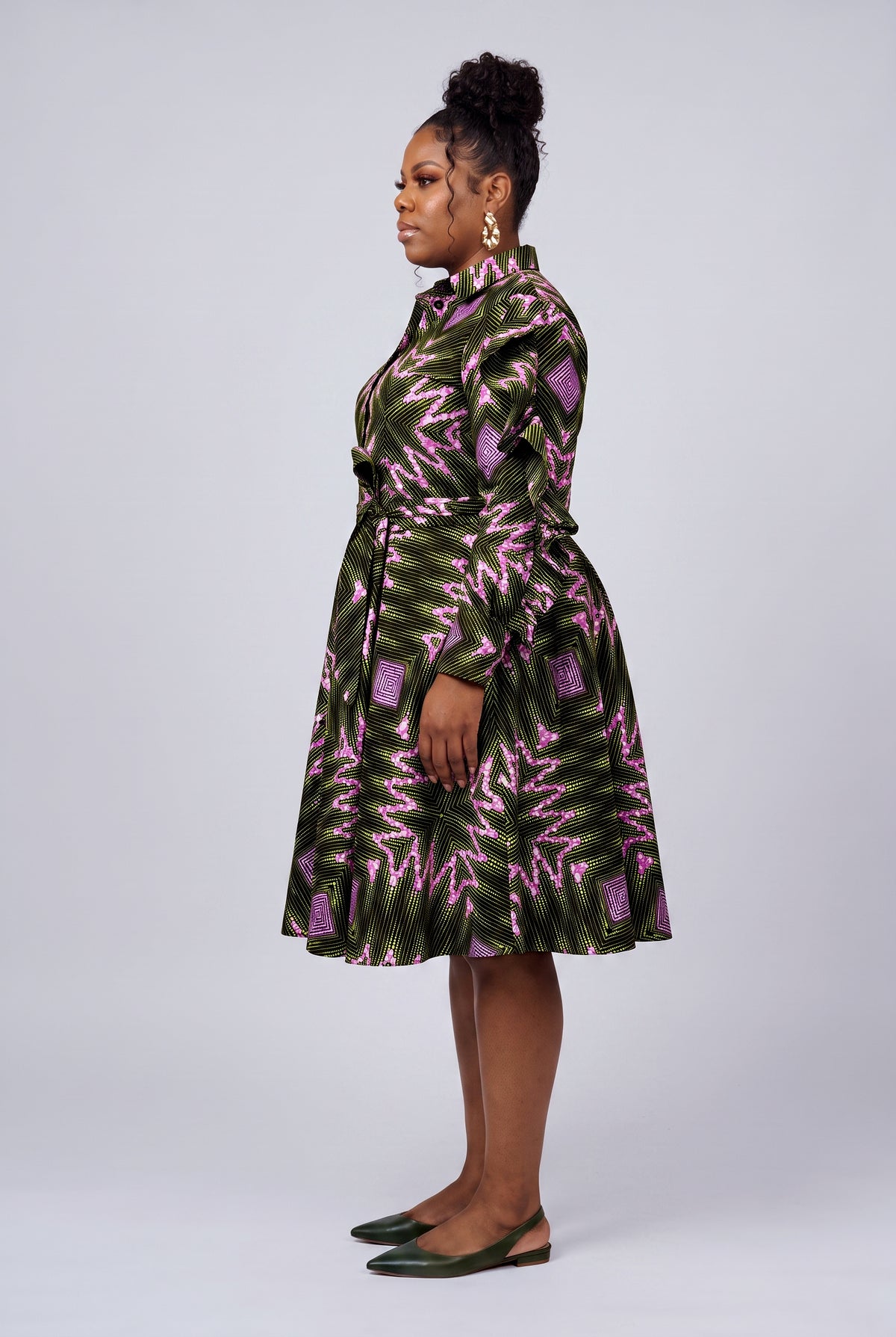 Side view of green African shirt dress showing ruffle sleeve detail
