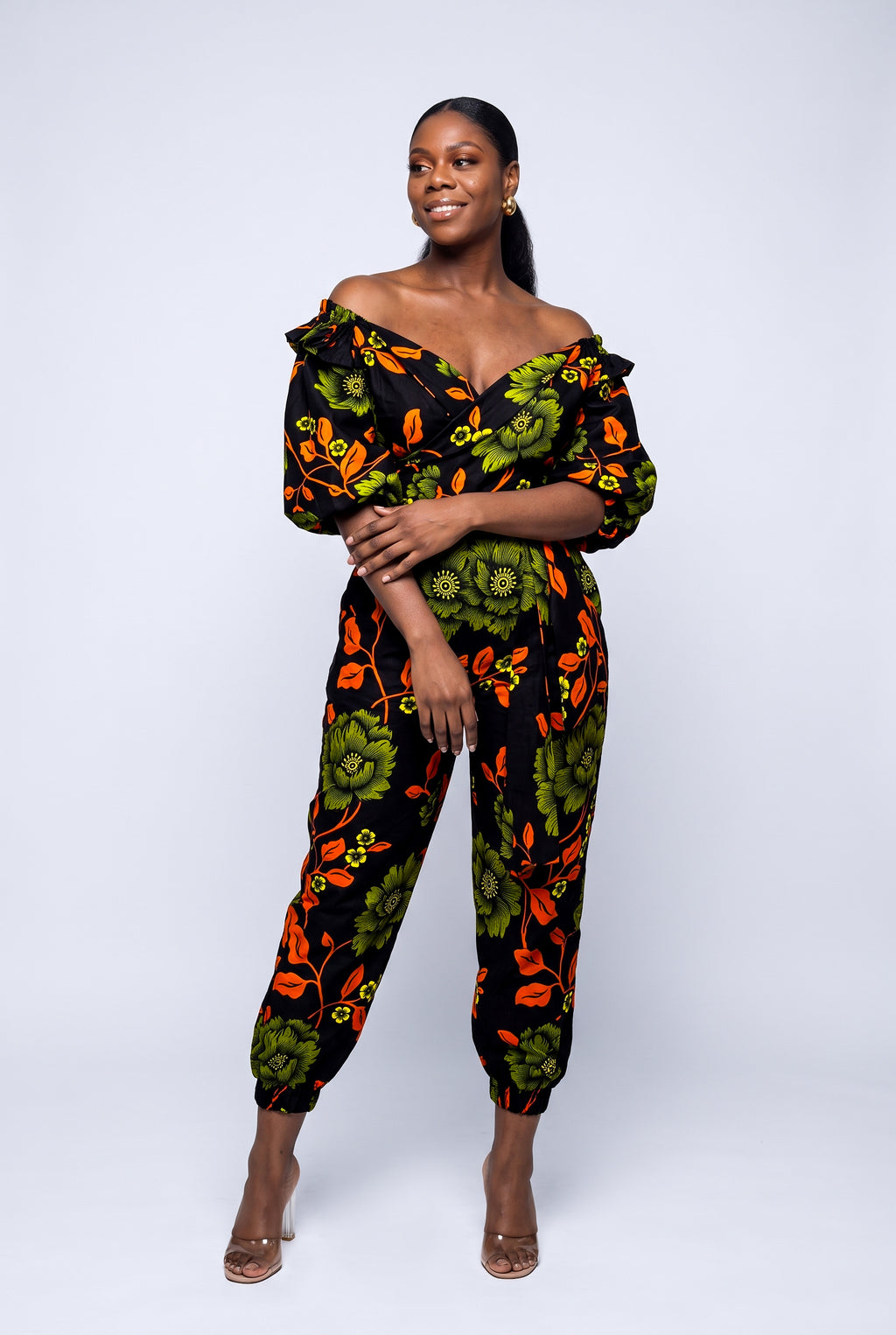 Full length view of green African print top and trouser set