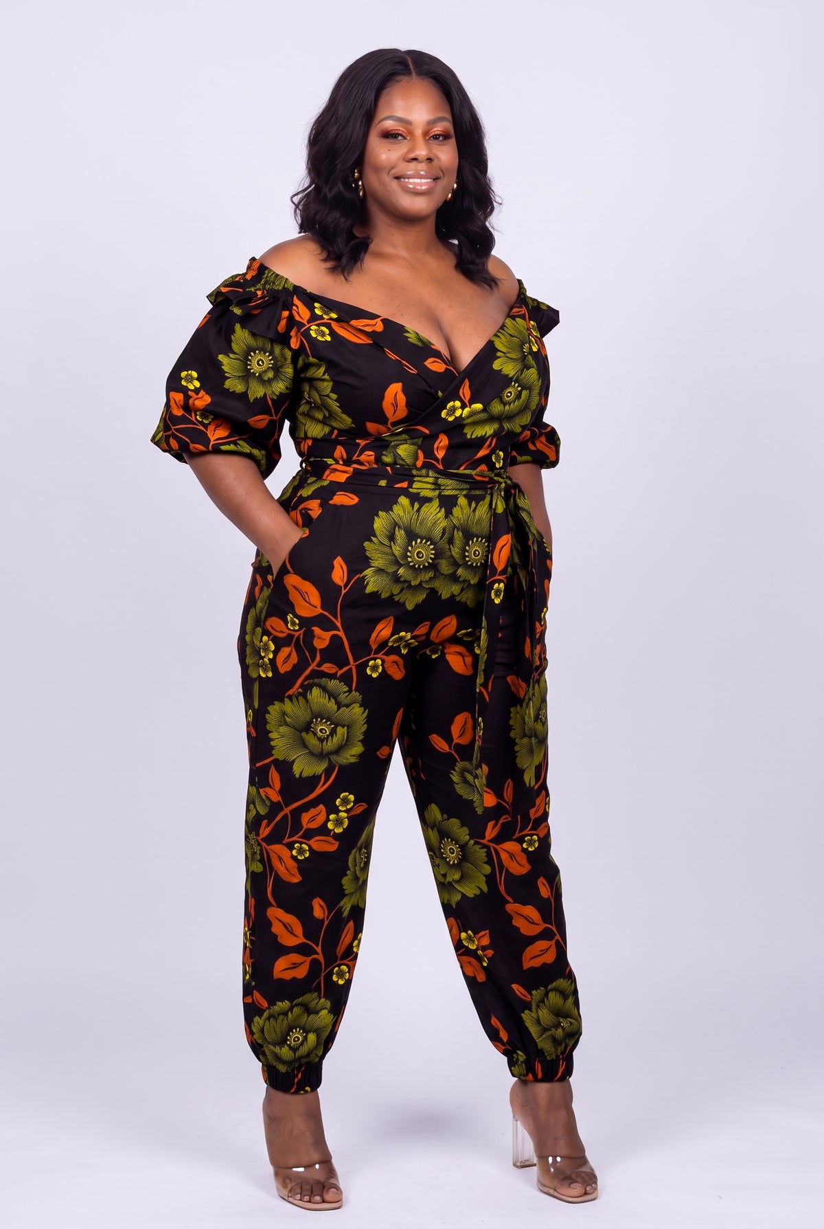 Plus size model three quarter view of Olive Oasis Ankara two piece outfit