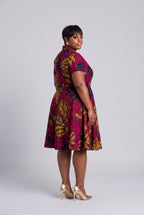 Plus size woman back view of pink African wrap dress in Ankara wax print