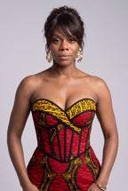 Close up of structured geometric grid pattern in red and gold strapless sweetheart corset Ankara dress 