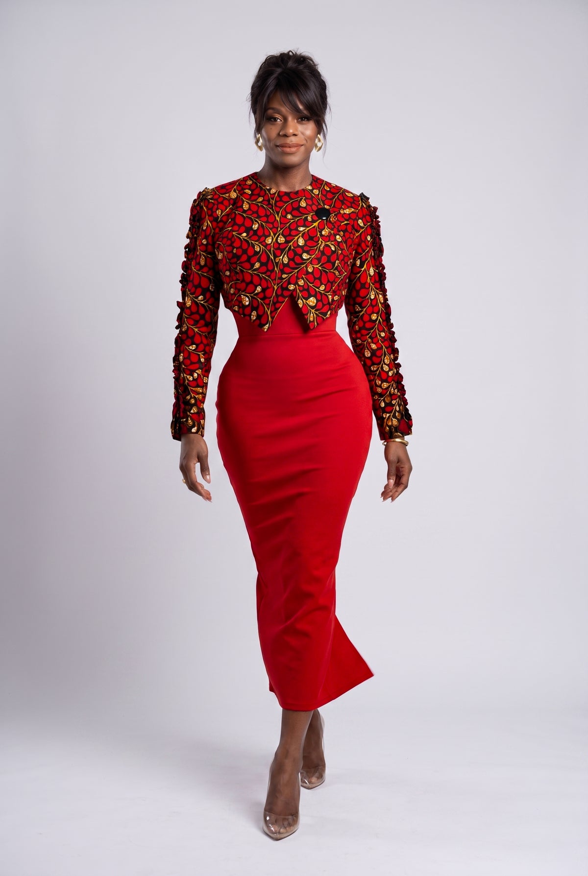 Model walking in Red Vine Ankara cropped jacket paired with a red bodycon dress