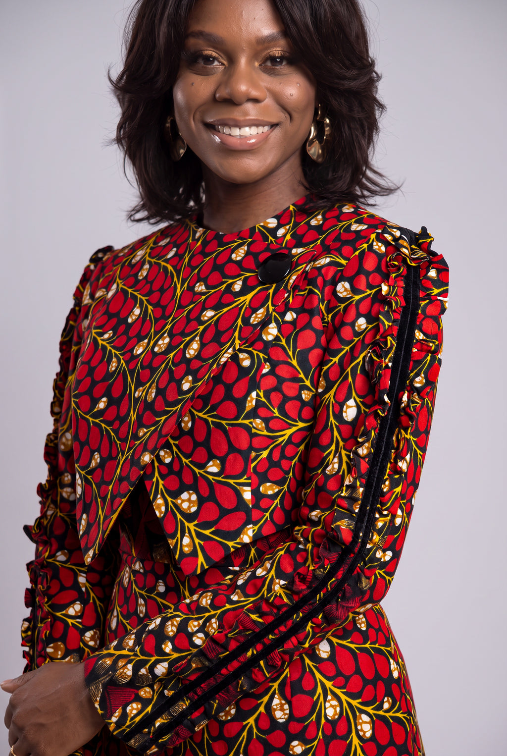 Model wearing Red Vine Ankara two piece wedding guest outfit