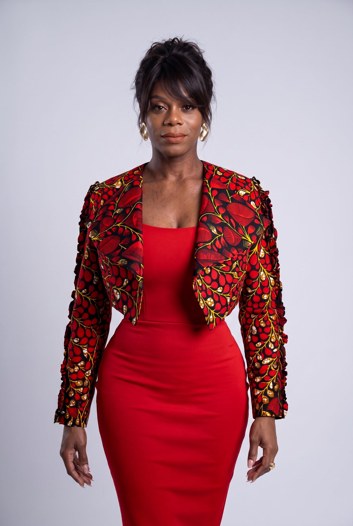 Luxury 100% cotton Ankara jacket arranged as an elegant African fashion print smart outfit choice for a wedding guest