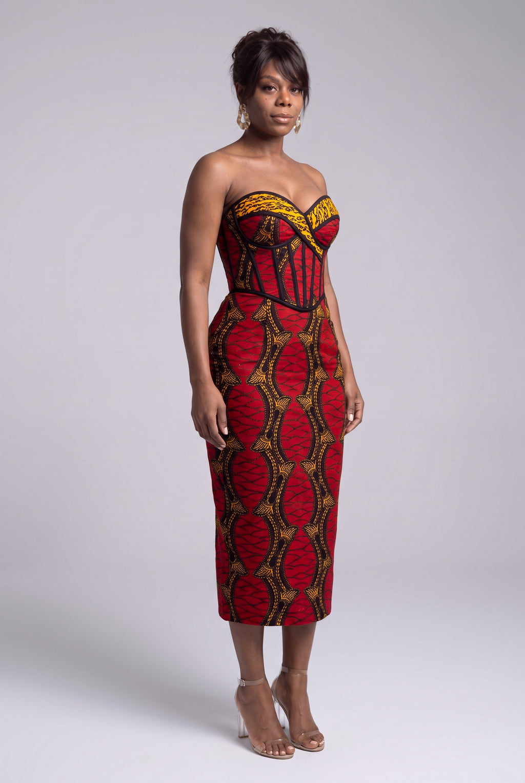 Side view of Red Grid red gold and black African Print corset dress