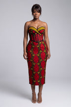 Model wearing Red Grid red African print strapless corset midi dress with a fitted silhouette
