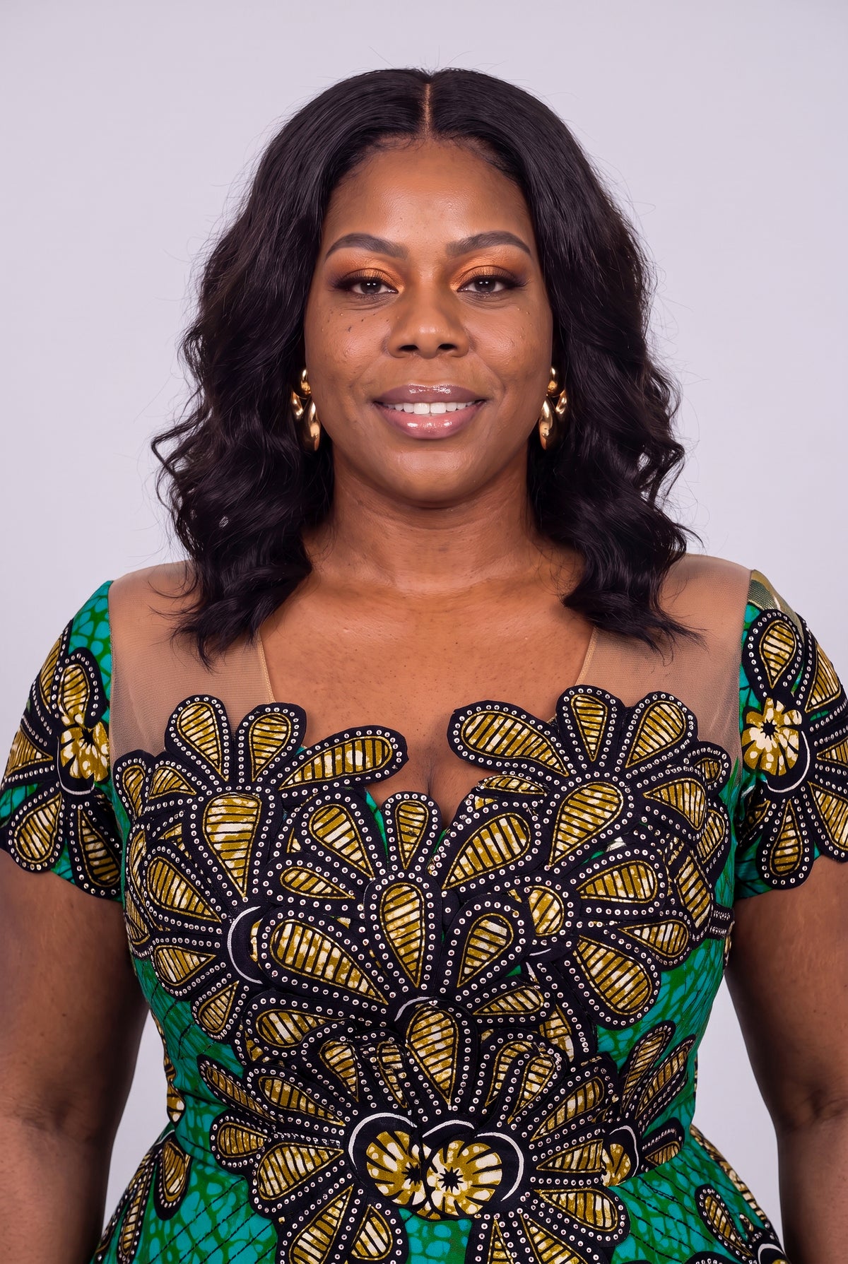 Detailed view of a structured sculptural waist peplum 100% cotton Ankara dress embellished with crystal rhinestones