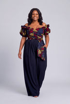 Plus size model wearing Ruby Nova navy Ankara wrap top