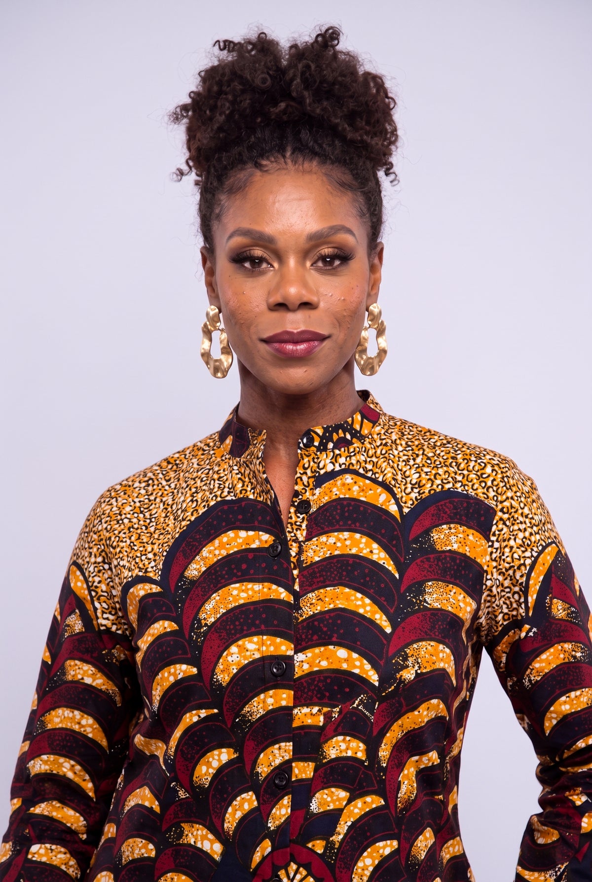  Front close up of Saffron Halo Ankara dress showing the stand collar, buttons and gold burgundy print