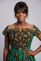 Teal and gold African print ceremonial midi wear dress arranged cleanly as an elegant autumn wedding guest look