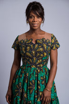 Close up of Teal Flora rhinestone embellished African Print skater dress 

