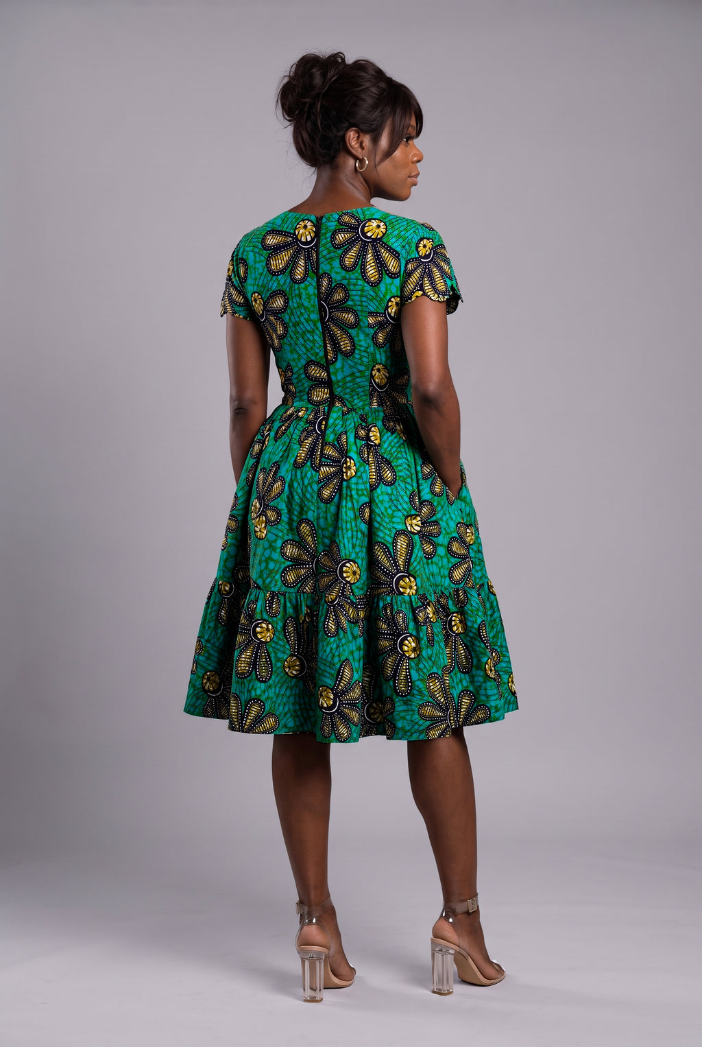 Back view of green African print tiered skater dress