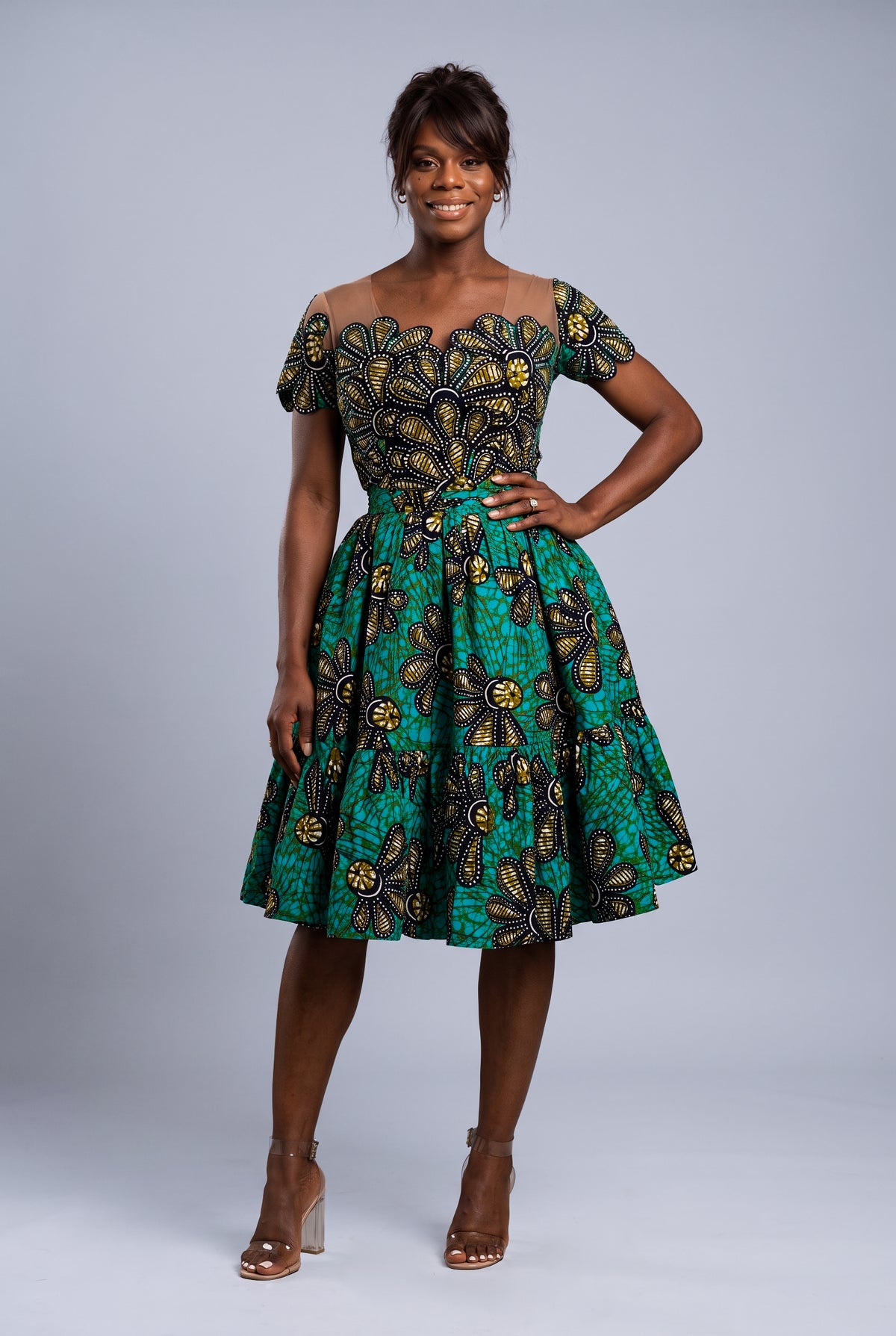 Full length view of green African print dress with tiered skater skirt