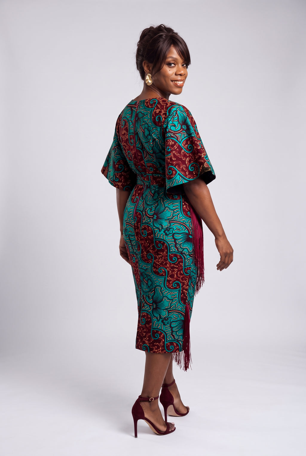 Back view of burgundy African print fringe midi dress