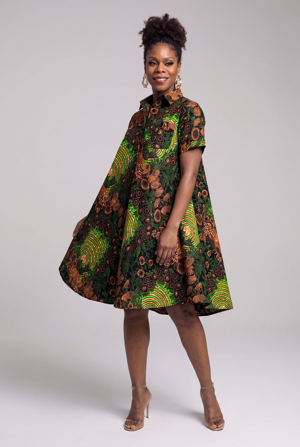 Three quarter view of Verdant Ripple African print swing shirt dress
