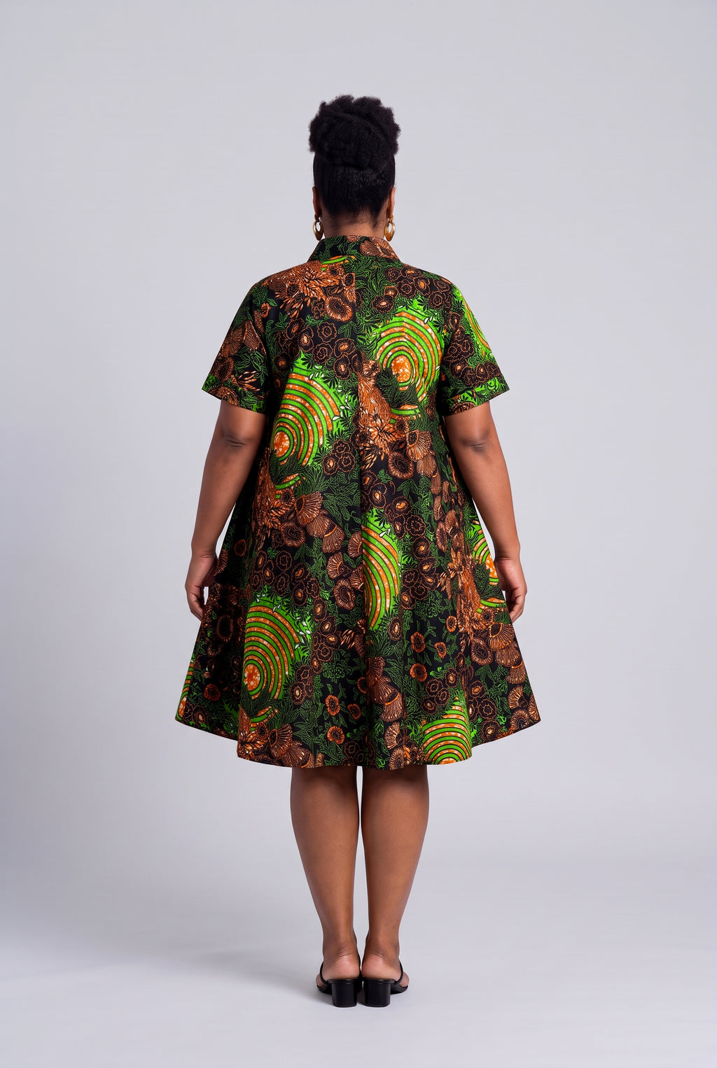Back view of Verdant Ripple green African print shirt dress with relaxed swing silhouette
