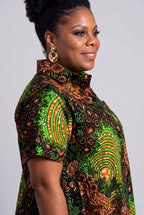 Close up of the green lime and copper botanical geometric Ankara wax print on the Verdant Ripple dress