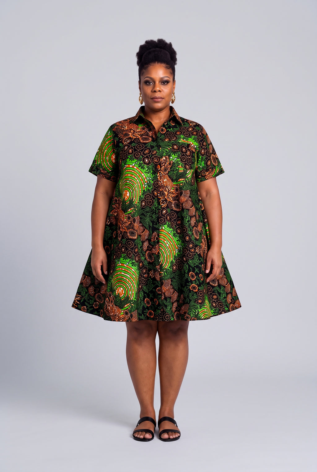  Plus size model wearing Verdant Ripple green Ankara swing shirt dress