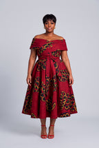 Plus size model wearing Ruby Fan red Ankara wedding guest dress