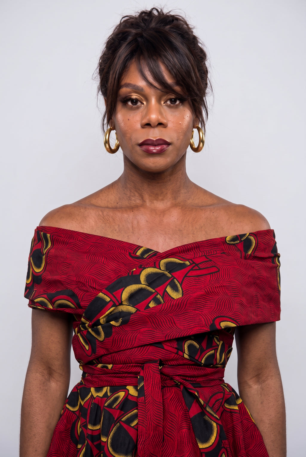Close up of Ruby Fan off shoulder neckline and fitted bodice