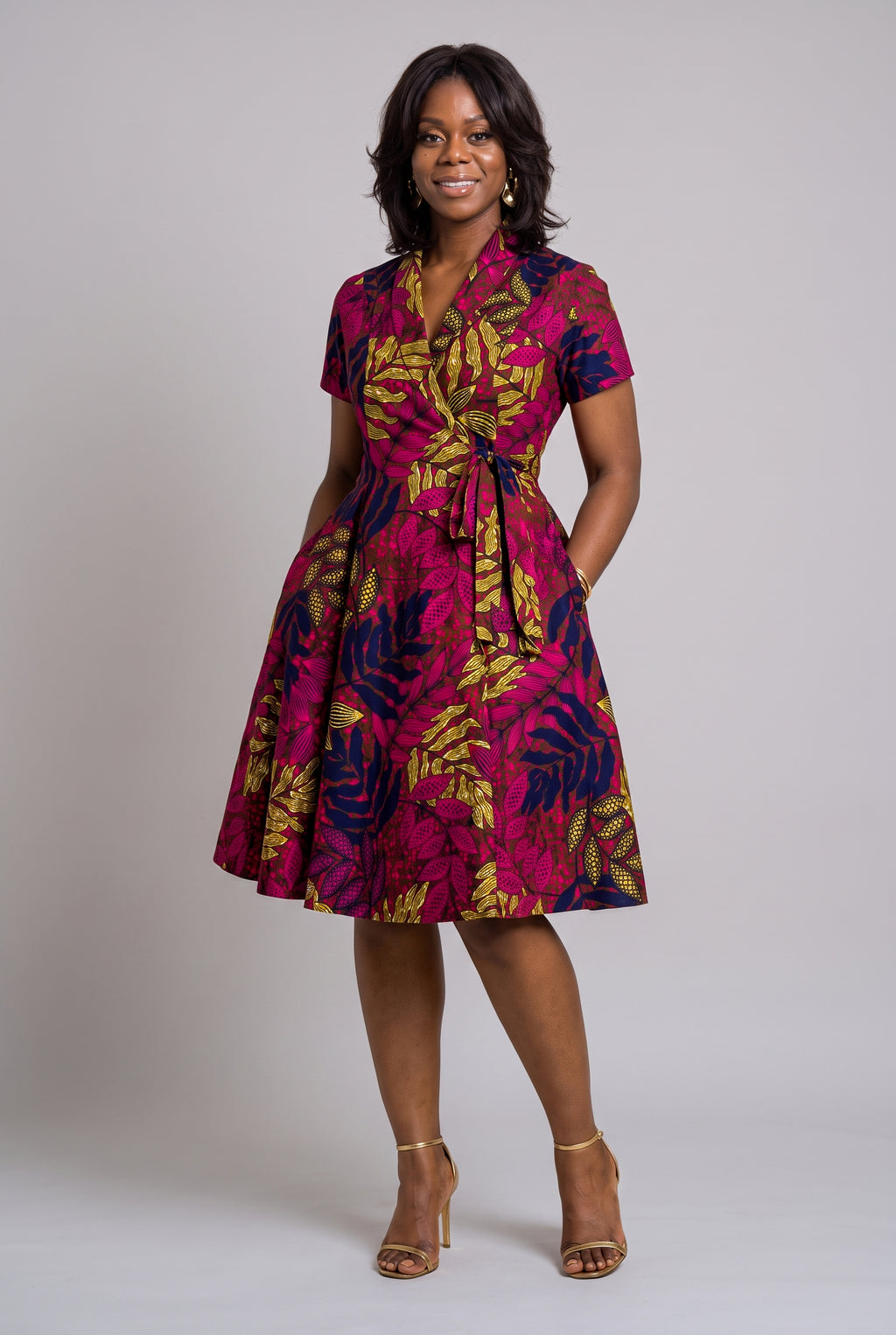 Front view of Fern Bloom pink African print wrap dress