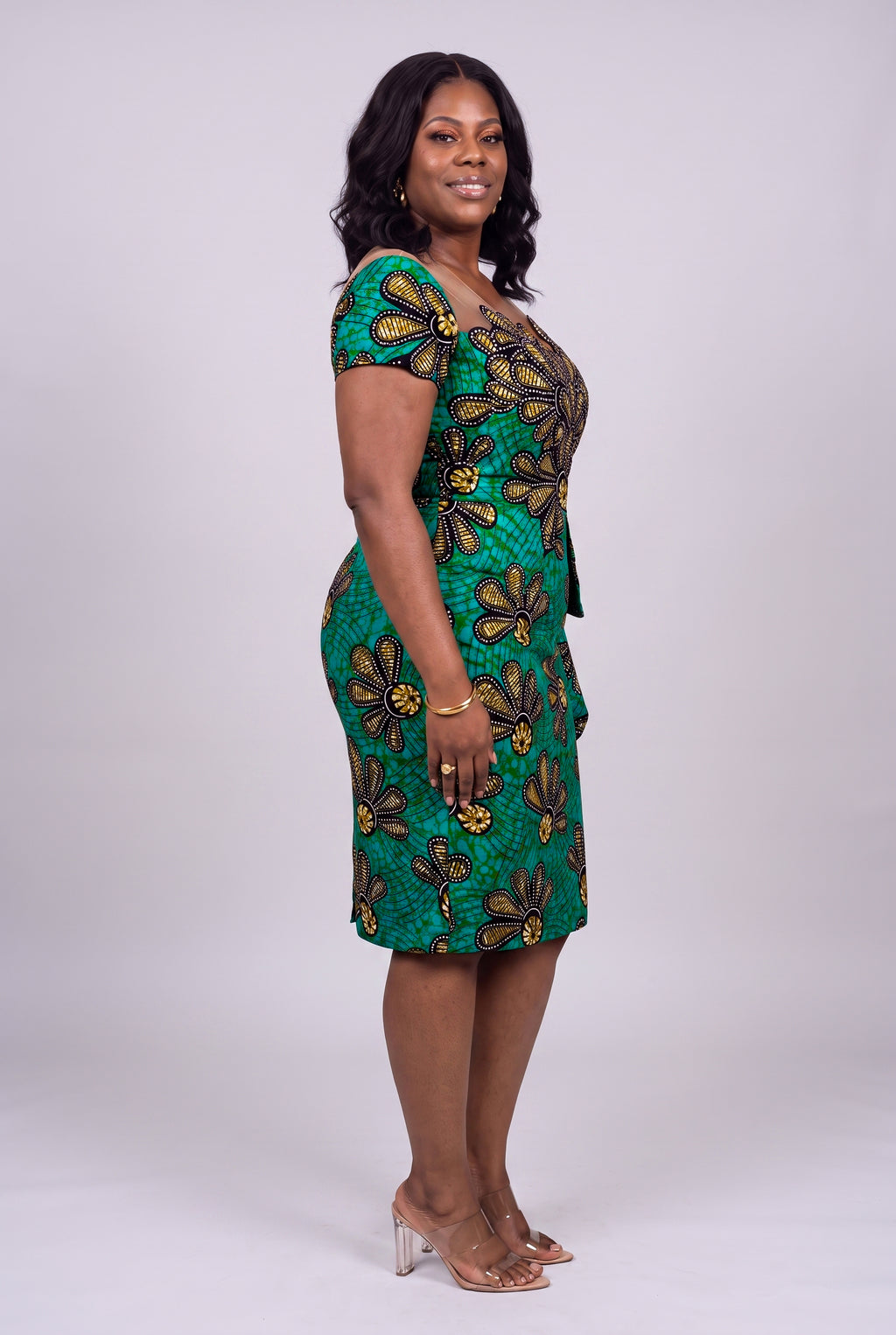 Side profile of Teal Flora African print peplum midi dress