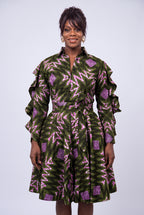 Detail view of green and pink geometric Ankara wax print fabric